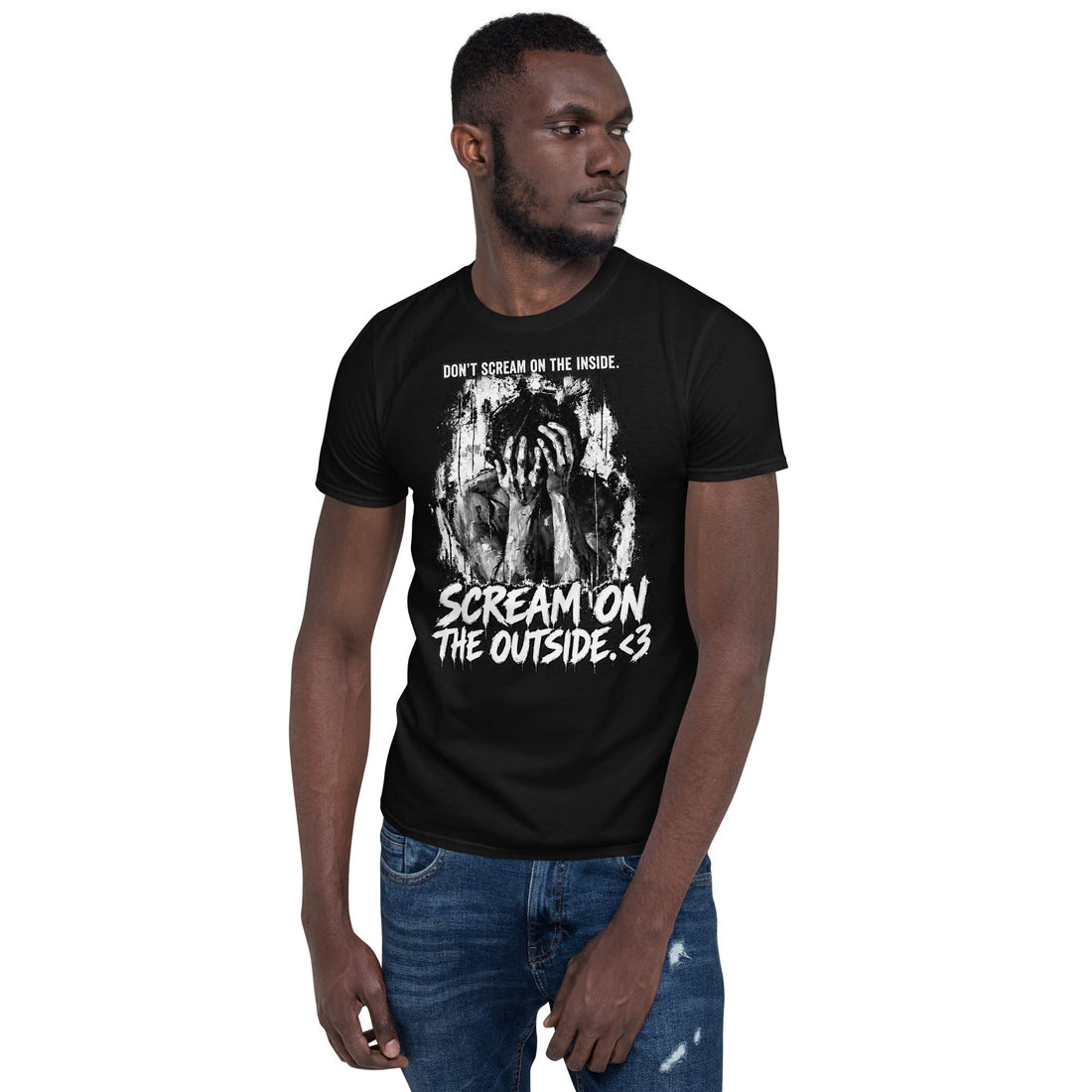 A model wearing the black Scream on the Outside T-shirt with a distressed black-and-white portrait and bold lettering.